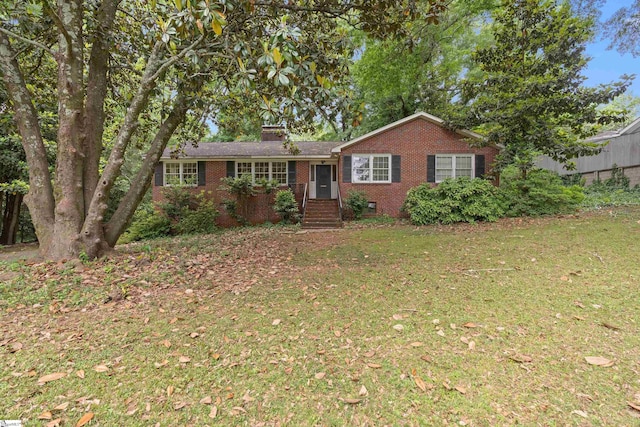 ranch-style home with crawl space, brick siding, and a front lawn