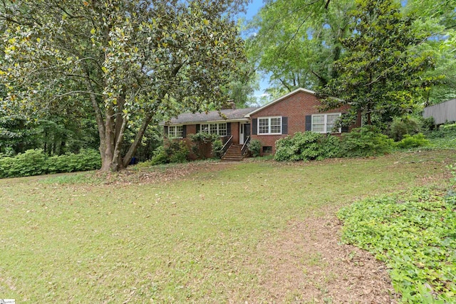 ranch-style home with a front yard