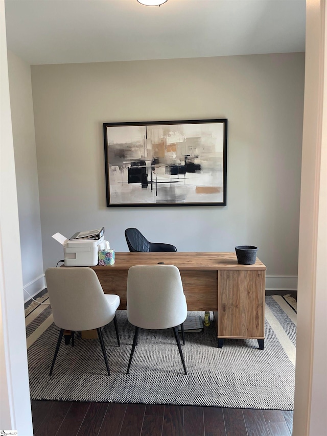 office space with dark hardwood / wood-style flooring