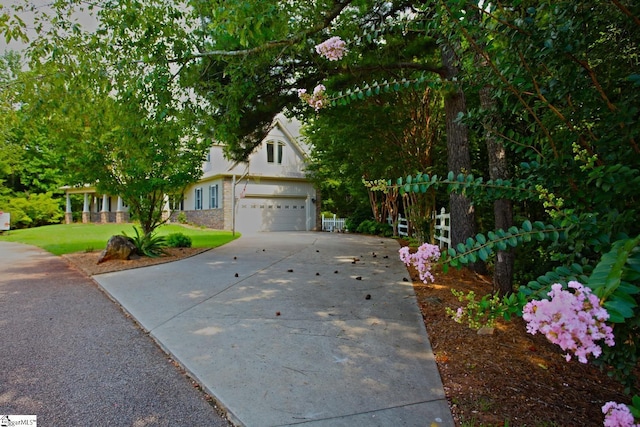302 Meadowlark Ln, Seneca, SC 29672 - view of property hidden behind natural elements with an attached garage, concrete driveway, and a front yard
