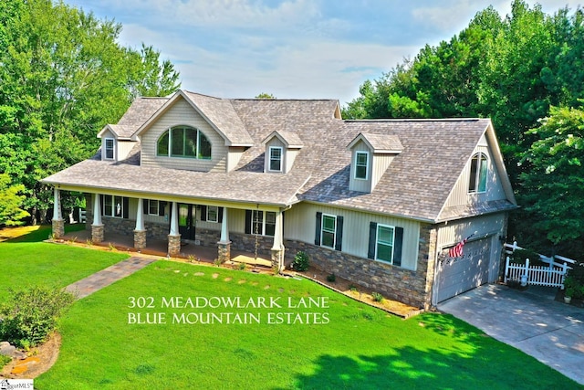 302 Meadowlark Ln, Seneca, SC 29672 - view of front of home featuring a front yard, a porch, stone siding, fence, and driveway