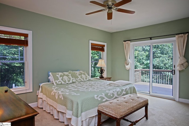 302 Meadowlark Ln, Seneca, SC 29672 - carpeted bedroom featuring a ceiling fan, access to exterior, baseboards, and multiple windows