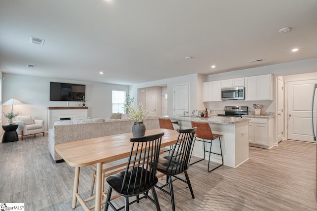 dining room featuring light hardwood / wood-style flooring