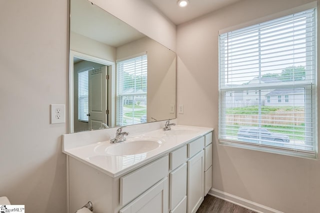 bathroom with vanity and hardwood / wood-style floors