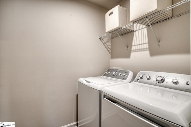 washroom with independent washer and dryer