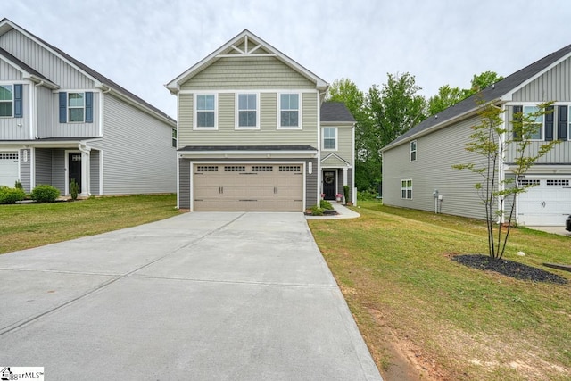 view of front facade with a garage and a front lawn