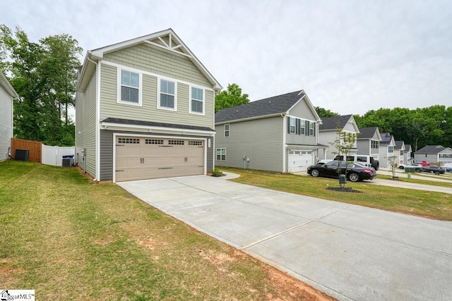 view of front facade with a garage, a front yard, and cooling unit