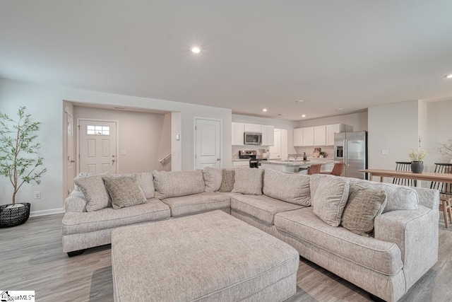 living room with light hardwood / wood-style floors