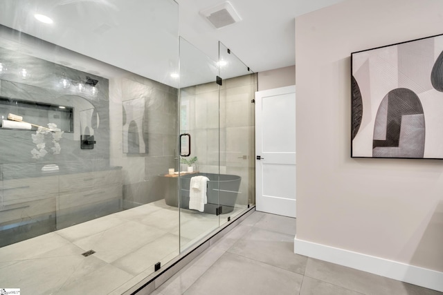 bathroom with tile patterned floors and a shower with shower door