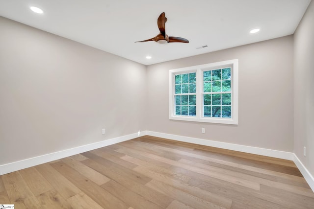 spare room featuring light hardwood / wood-style floors and ceiling fan