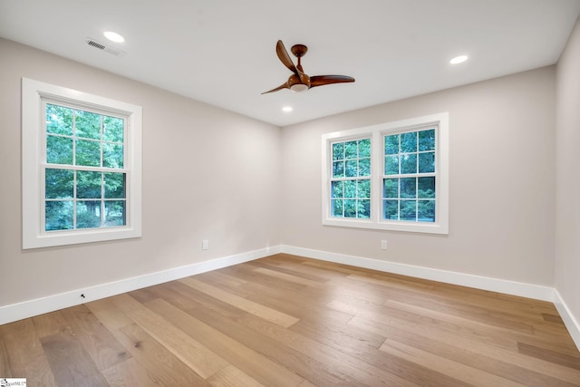 unfurnished room with ceiling fan and light hardwood / wood-style flooring