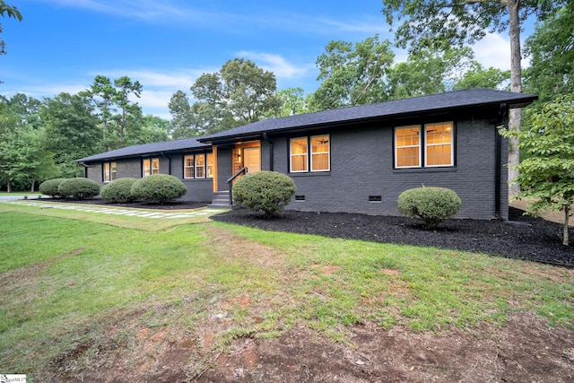 ranch-style house with a front lawn