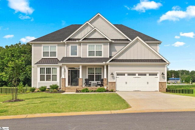 craftsman-style home with a garage and a front yard