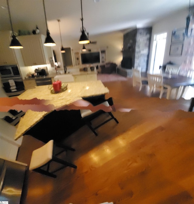 dining room with sink and wood-type flooring