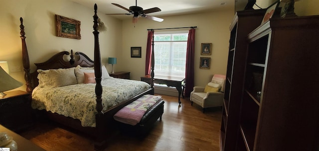 bedroom with hardwood / wood-style floors and ceiling fan