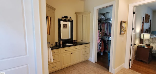 bathroom featuring tile patterned floors and vanity