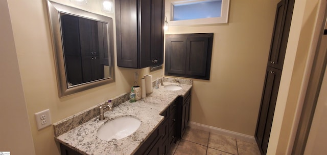 bathroom with tile patterned floors and double sink vanity