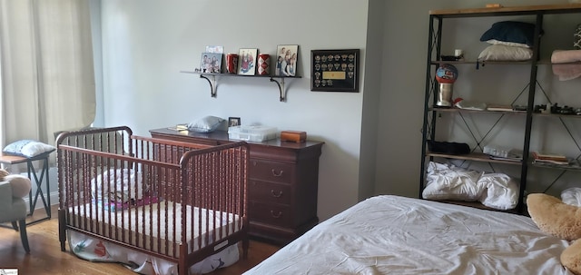 bedroom with wood-type flooring