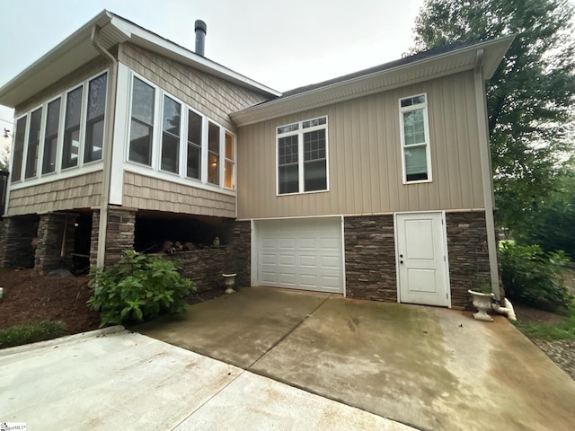 view of side of home featuring a garage