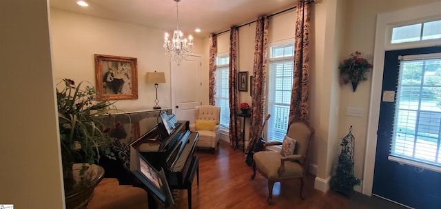 interior space featuring dark hardwood / wood-style flooring and a chandelier