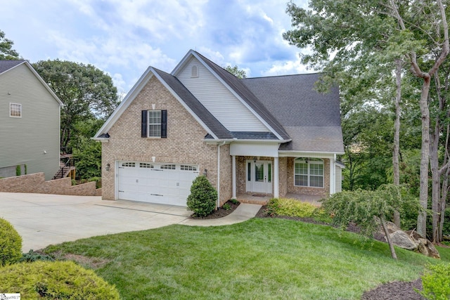 view of front of home featuring a garage and a front yard