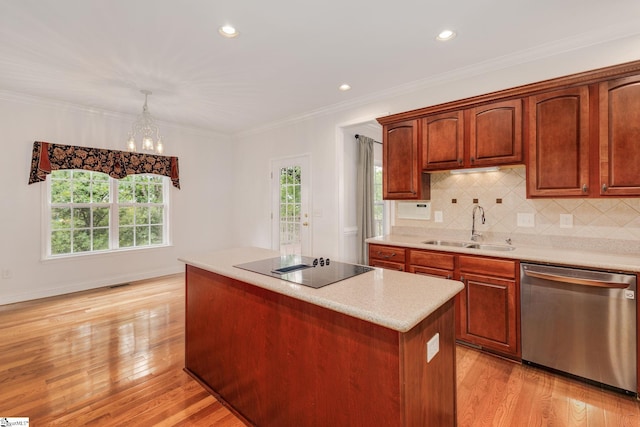 kitchen with sink, dishwasher, light wood-type flooring, and a healthy amount of sunlight