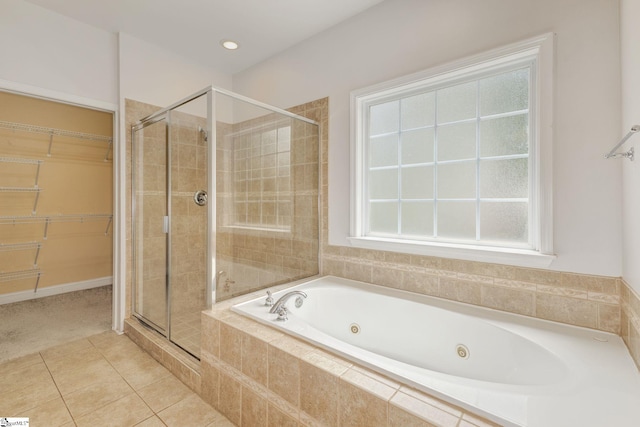 bathroom featuring shower with separate bathtub and tile patterned floors