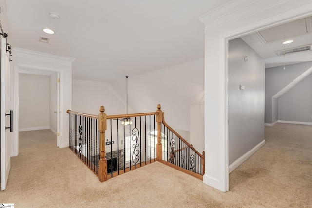 corridor featuring carpet flooring, vaulted ceiling, and crown molding