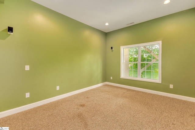 unfurnished room featuring carpet floors