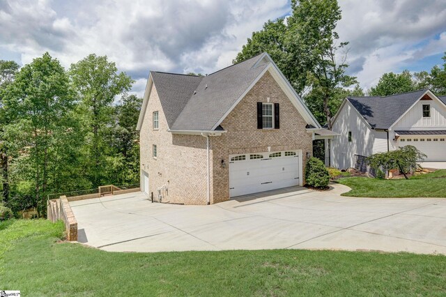 view of front of home with a garage and a front yard