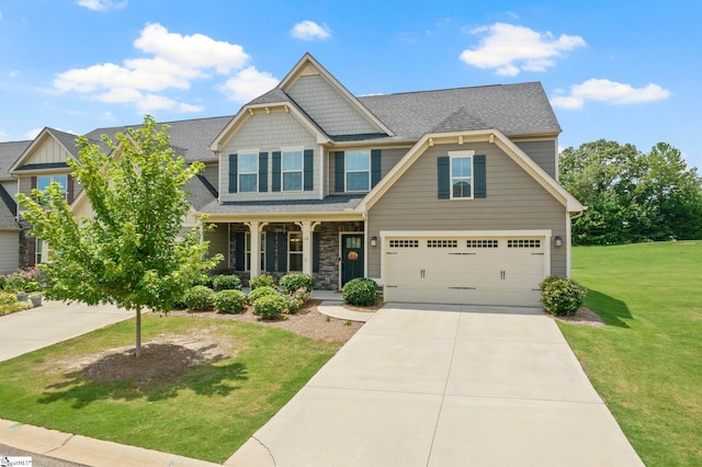 craftsman-style home with a garage and a front lawn