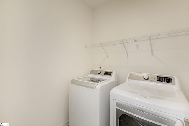 laundry room with washer and clothes dryer