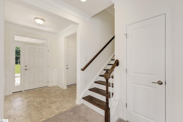 tiled foyer with crown molding