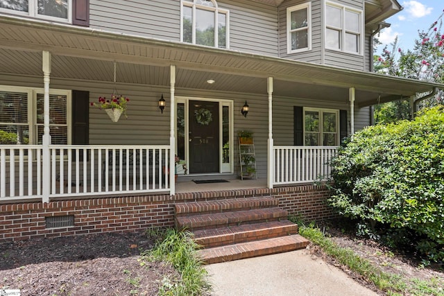 property entrance featuring a porch
