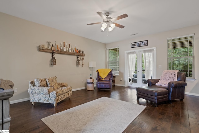 living room featuring dark hardwood / wood-style floors, french doors, and ceiling fan