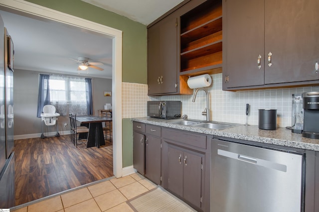 kitchen with sink, ceiling fan, light tile patterned flooring, decorative backsplash, and stainless steel dishwasher