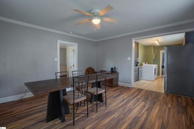 dining room with wood-type flooring, washer / dryer, ornamental molding, and ceiling fan