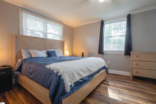 bedroom featuring ceiling fan, ornamental molding, and dark hardwood / wood-style flooring