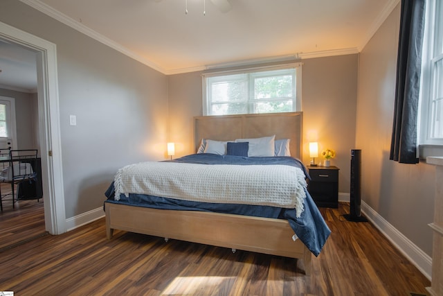 bedroom with ornamental molding and dark wood-type flooring