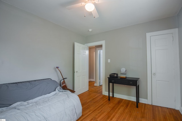 bedroom featuring ceiling fan and light hardwood / wood-style flooring