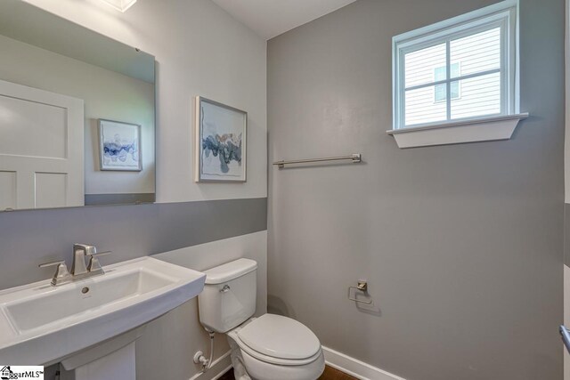 bathroom featuring toilet and sink