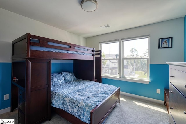 bedroom with light carpet