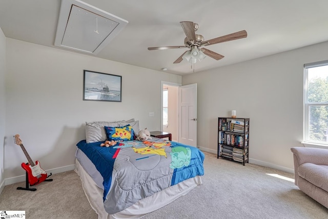 bedroom featuring light carpet and ceiling fan