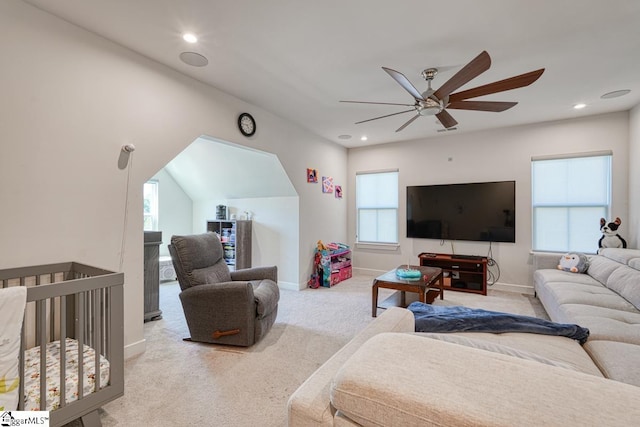 carpeted living room featuring a healthy amount of sunlight and ceiling fan