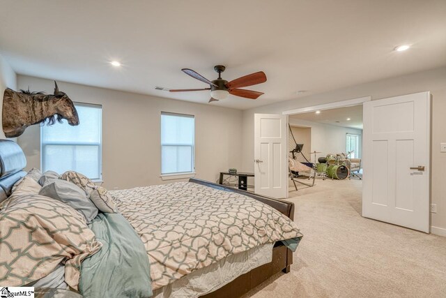 carpeted bedroom featuring ceiling fan