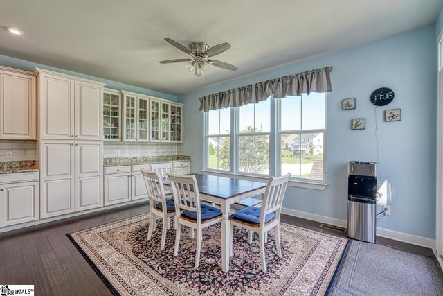 dining area featuring dark hardwood / wood-style floors and ceiling fan