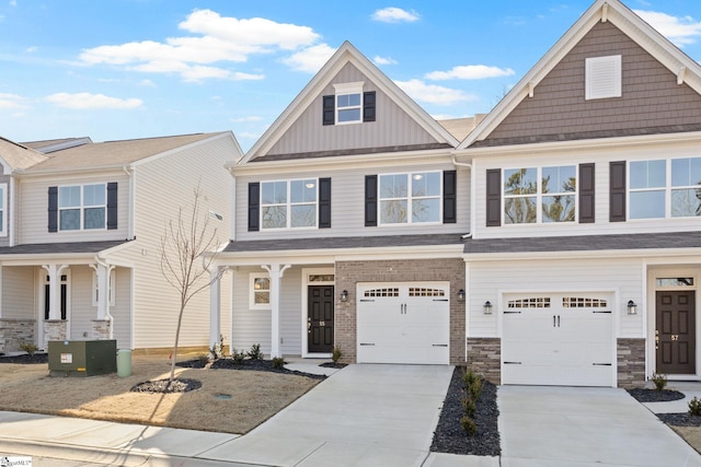 view of front of house featuring a garage and central air condition unit