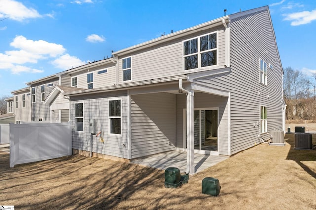 rear view of property with central AC and a patio area