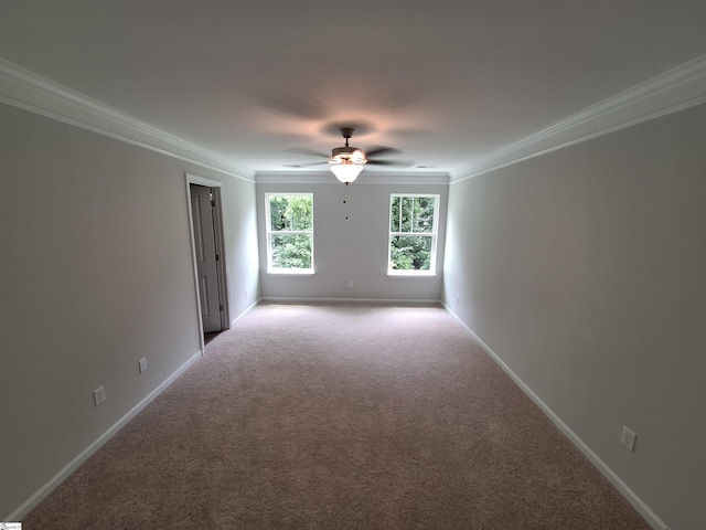 carpeted empty room with ornamental molding and ceiling fan