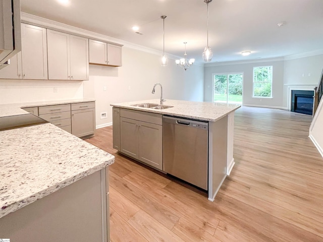 kitchen with gray cabinetry, dishwasher, pendant lighting, light wood-type flooring, and sink